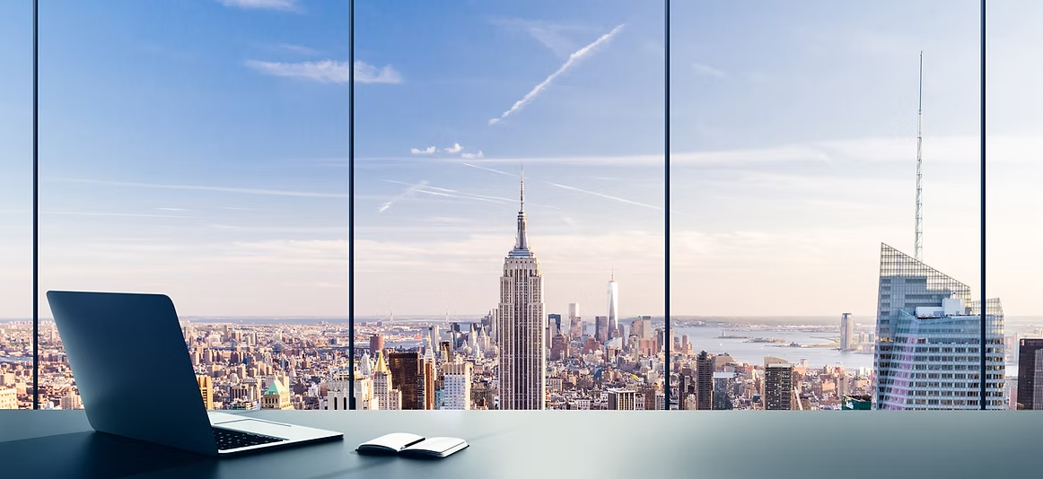 Laptop overlooking a city skyline